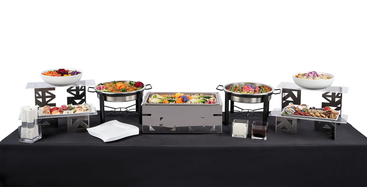 An Asian Themed Menu is displayed buffet-style with assorted dishes, including gluten-free and dairy-free options, in metal chafing trays and bowls, plus napkins, cutlery, condiments, and serving utensils on a black tablecloth.