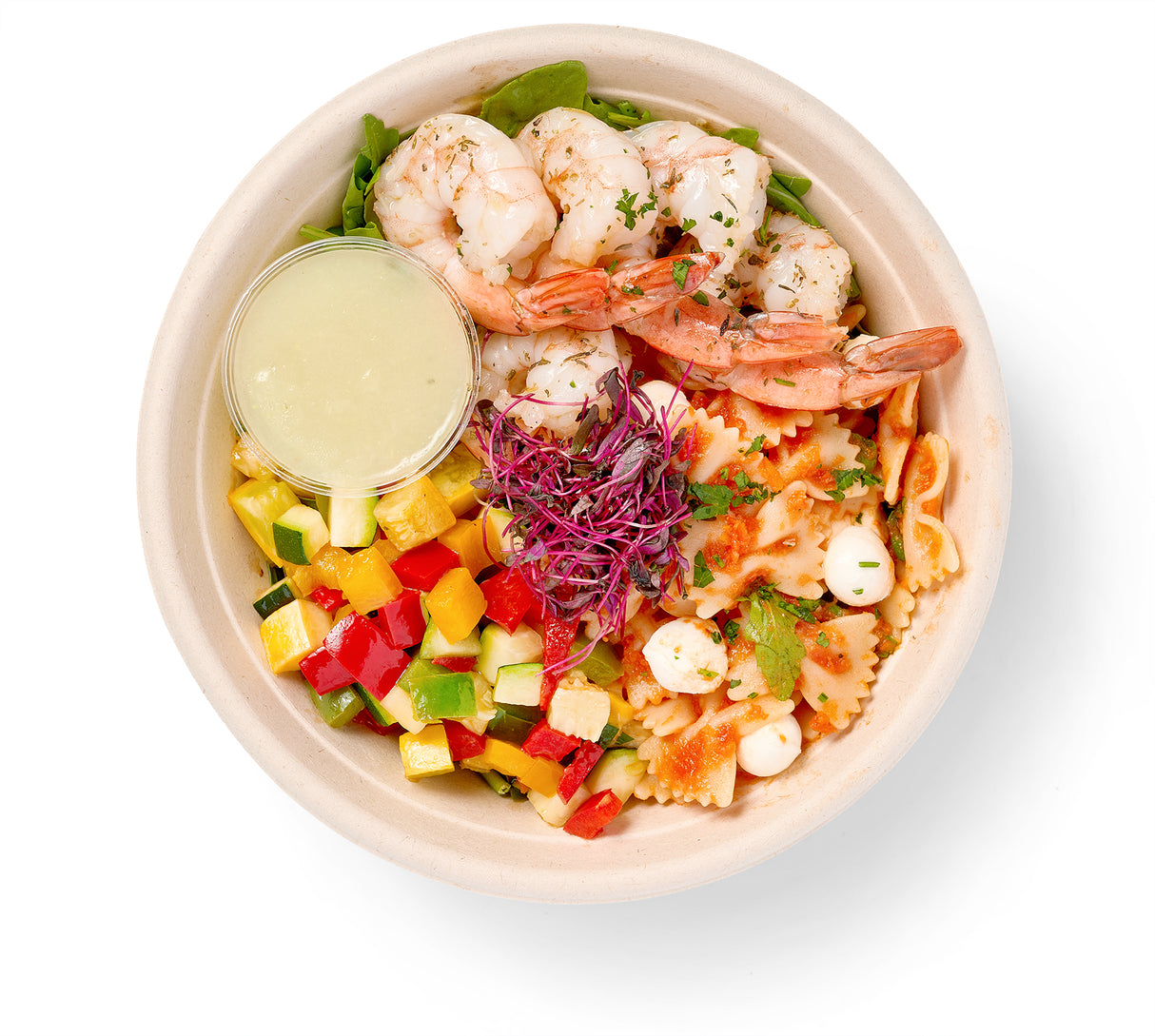 A protein-packed bowl of Lemon Garlic Entree Bowl with shrimp, vegetables, and sundried tomatoes.