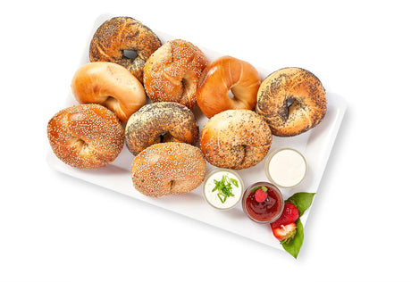 The Homemade Bagels & Spreads tray includes eight assorted bagels and four small topping containers—cream cheese, chives, strawberry jam, and a strawberry garnish—perfect for displaying options with the Product Options App.