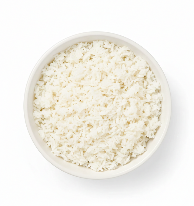 A white bowl filled with cooked Jasmati Rice, photographed from above on a white background.