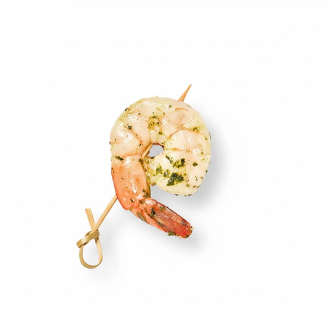 A Grilled Gremolata Shrimp, seasoned with garlic and parsley, is skewered on a small wooden stick and displayed against a plain white background.