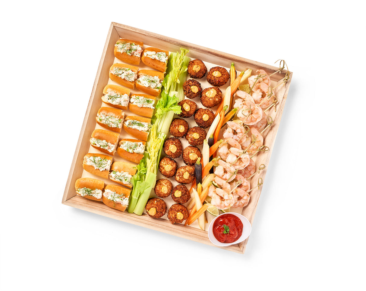 A Seafood Party Platter with a variety of appetizers, including Mini Crab Cakes and Shrimp Cocktail Shooters.