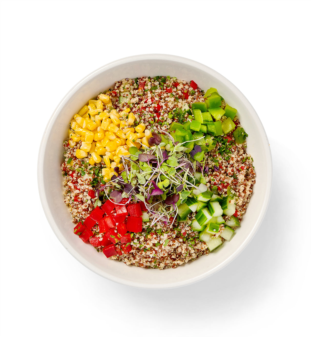 A bowl filled with {Quinoa}, fresh herbs and vegetables.