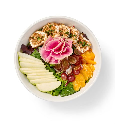 A bowl of Citrus Salad in a white bowl.